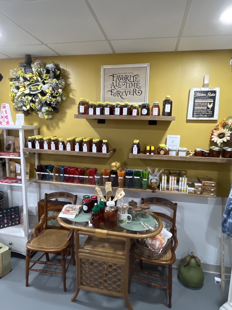 Shelves of Henrietta Honey bottles and honey sticks inside the shop