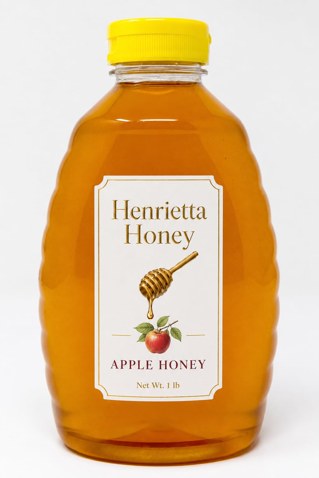 A 1 lb bottle of Henrietta Honey apple infused honey with a gold foil label