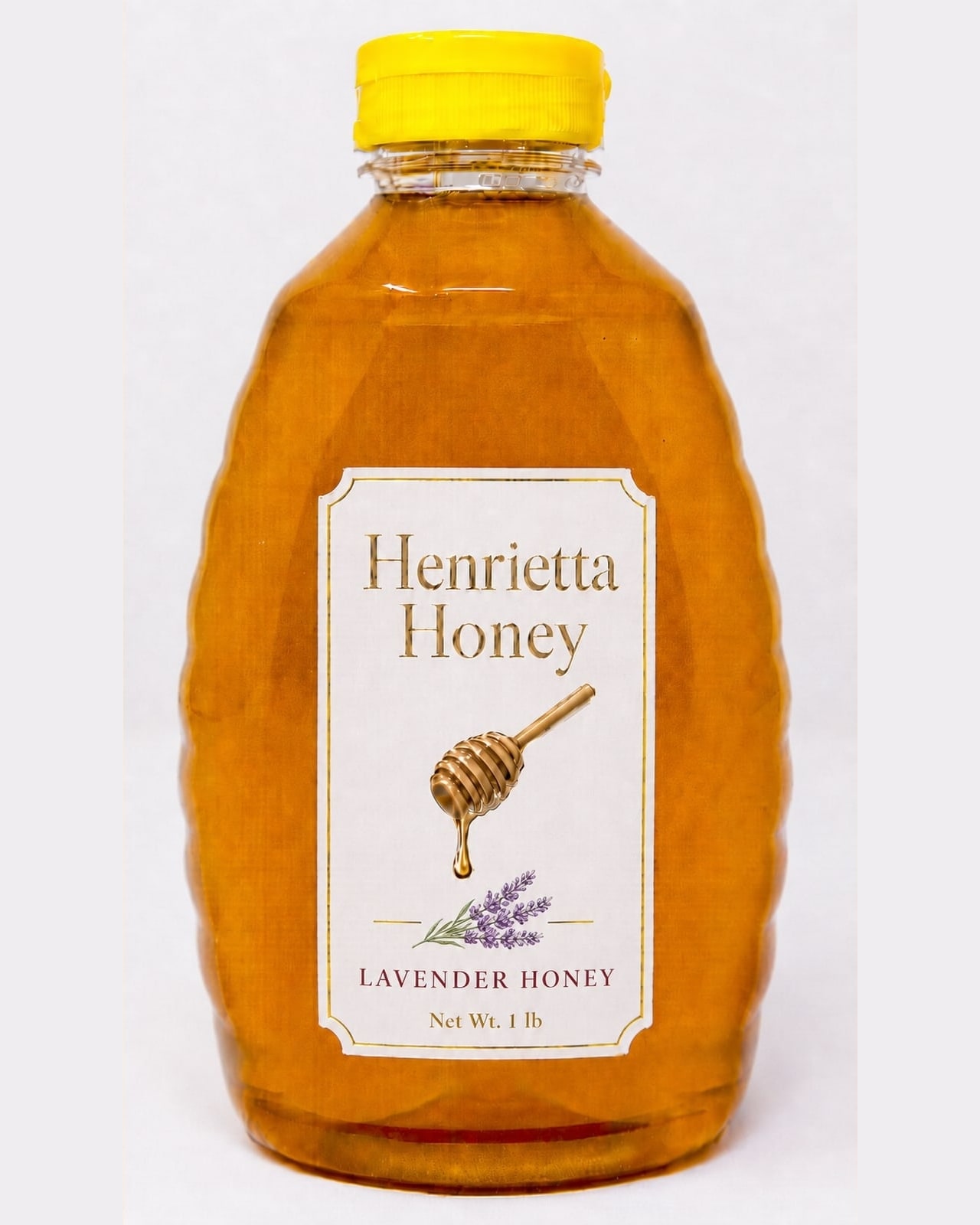 A 1 lb bottle of Henrietta Honey lavender infused honey with a gold foil label
