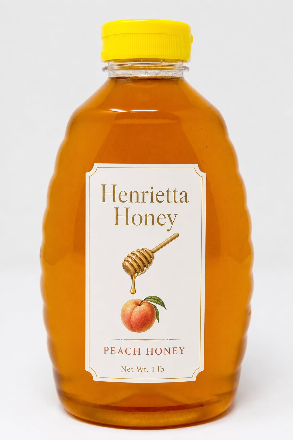 A 1 lb bottle of Henrietta Honey peach infused honey with a gold foil label
